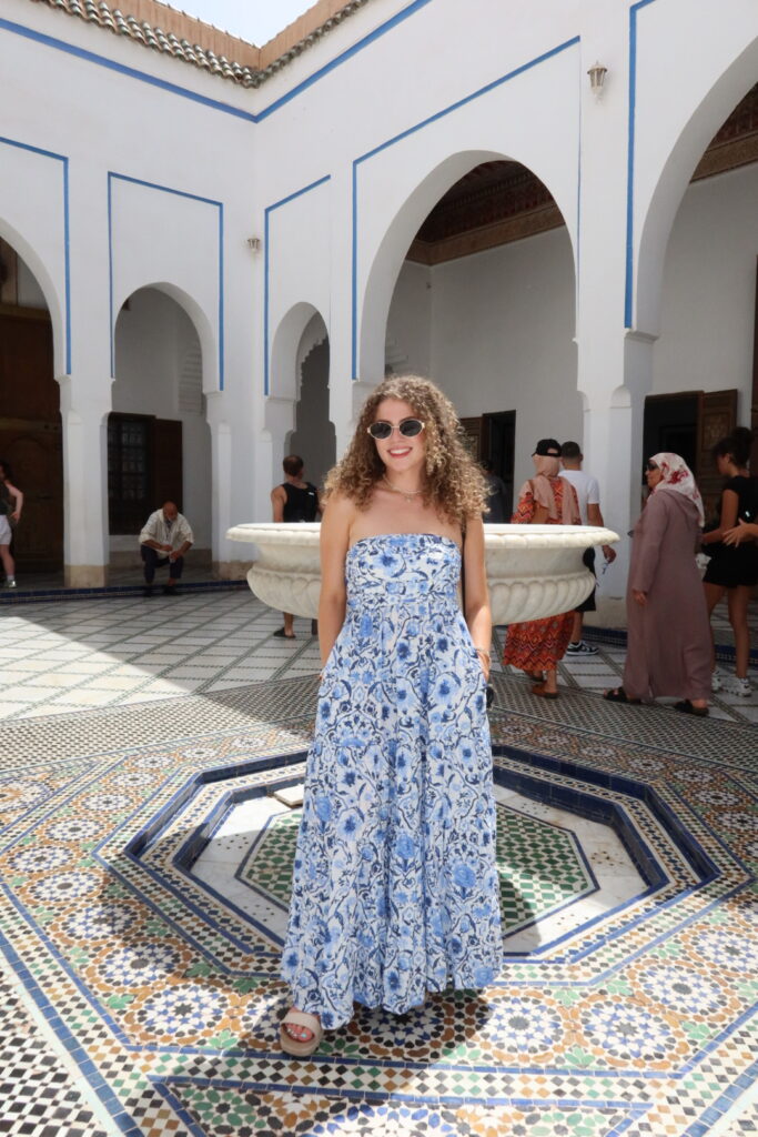 woman at bahia palace in marrakech, morocco. Explaining what to wear in Morocco as a woman